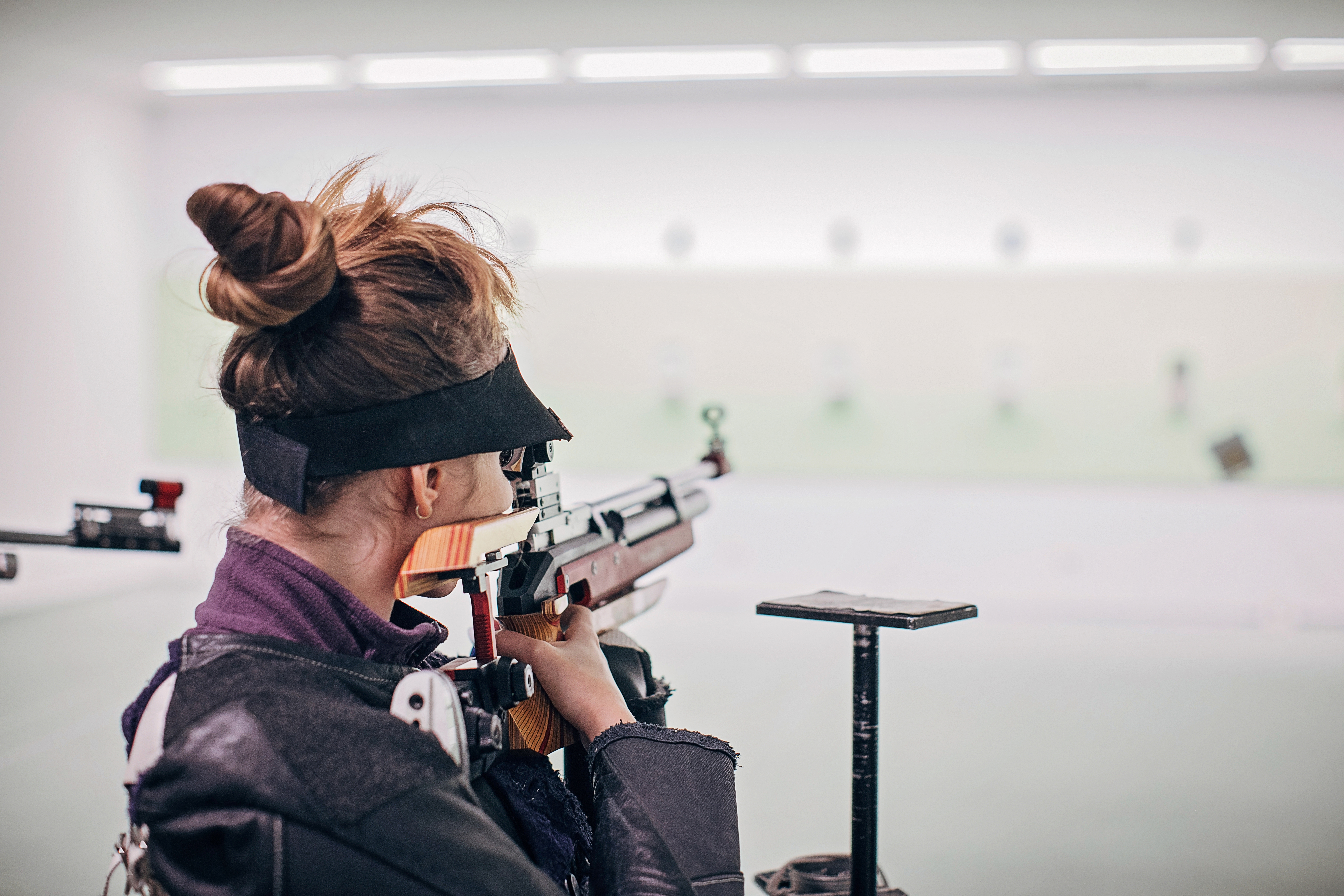 Teenage girl on rifle shooting practice