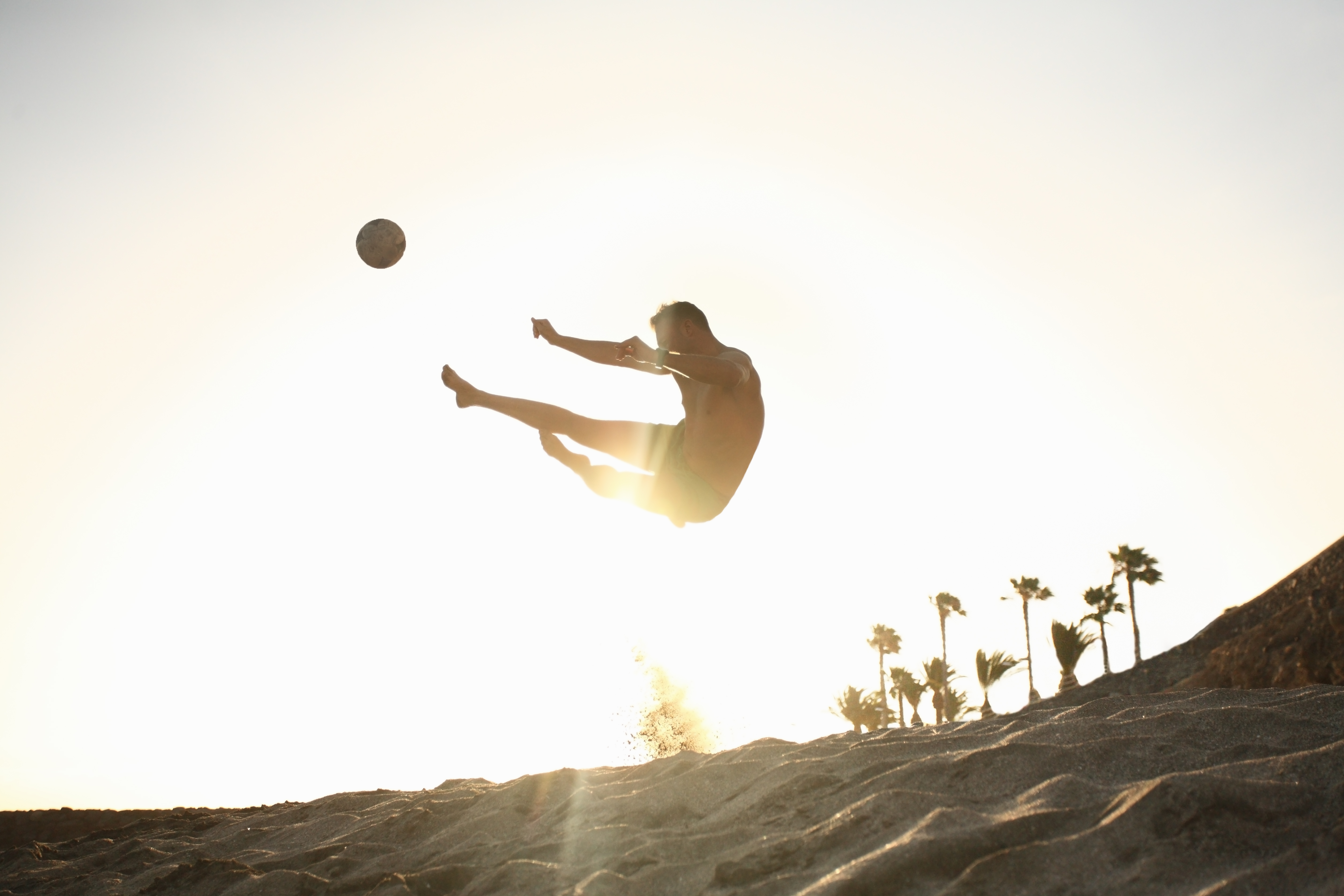 Man playing beach soccer